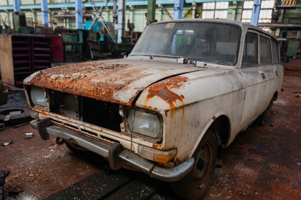 old rusty soviet car front view territory workshop abandoned old industrial plant